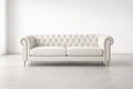 Sofá Chesterfield de cuero con patas de madera en blanco