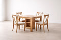 Juego de mesa de comedor de madera con cuatro sillas